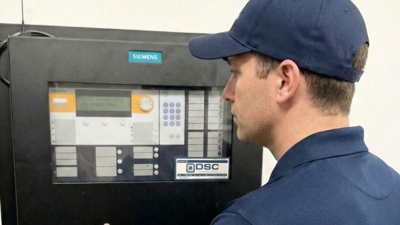 DSC technician inspecting Siemens panel