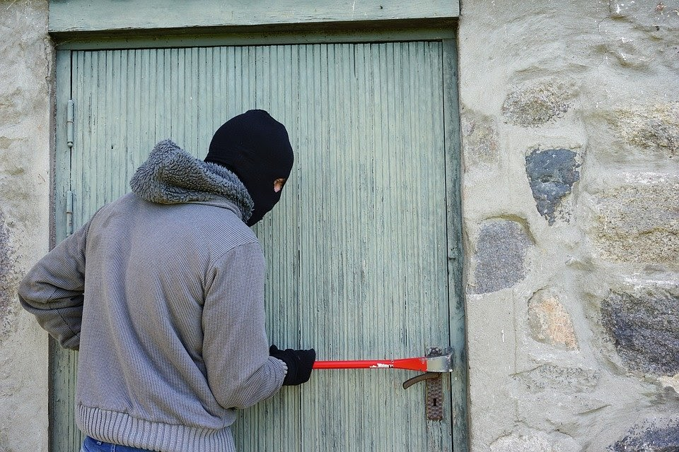 burglar attempting to break in to a building