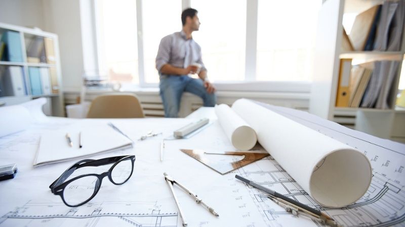 engineer working on facility drawings-1