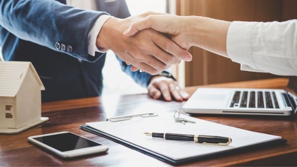shaking hands after contract agreement-1
